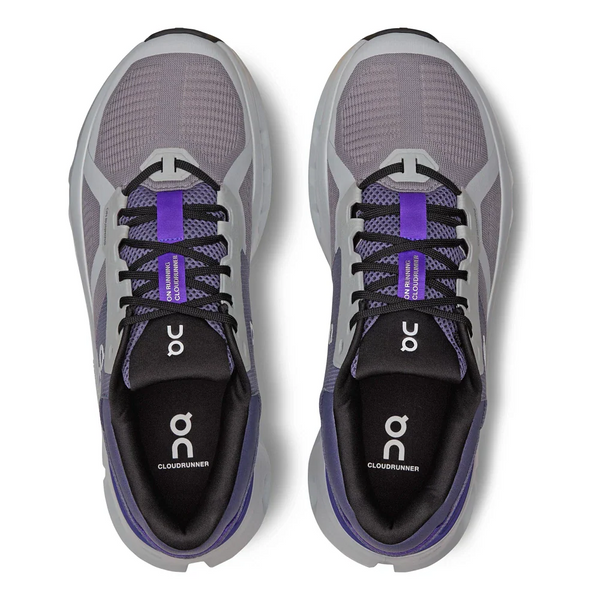 Pair of gray and indigo running shoes with 'On' branding on a white background.