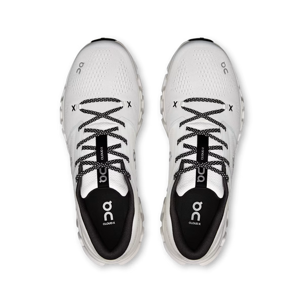 A pair of white and black On Cloud running shoes shown from a top-down view on a clean white background.