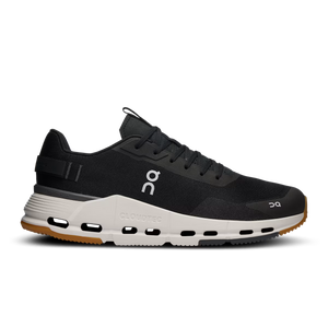 Black running shoe with white sole on a white background