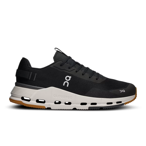 Black running shoe with white sole on a white background