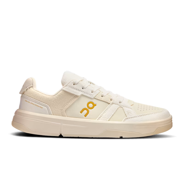 Beige sneaker with a logo on a white background