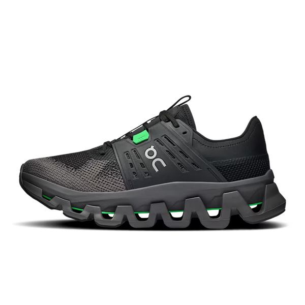 A black athletic sneaker with a chunky, wavy sole and a small bright green accent near the laces, shown in a side profile on a white background.