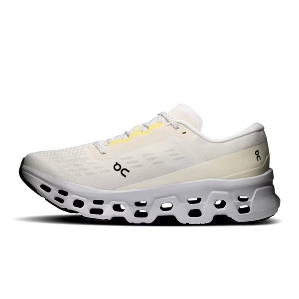 A single On running shoe in off-white and cream with a black and white cushioned sole, featuring a small yellow accent near the laces and a black On logo on the side.