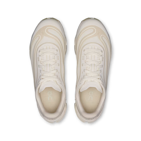 A pair of off-white and beige chunky sneakers shown from a top-down view on a solid white background.