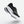 Black and white running shoe with 'Kiprun' branding on a light gray background