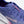 Purple running shoe with 'Kiprun' branding on a light gray background