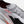Gray running shoe with visible branding on a white background