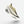 Yellow running shoe on a light gray background