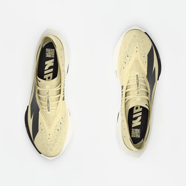 Pair of yellow and black sneakers on a white background