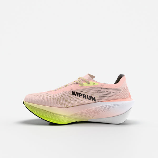 Pink running shoe with green sole on a white background