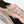 Pink running shoe with green accents and 'KIPRUN' branding on a white background