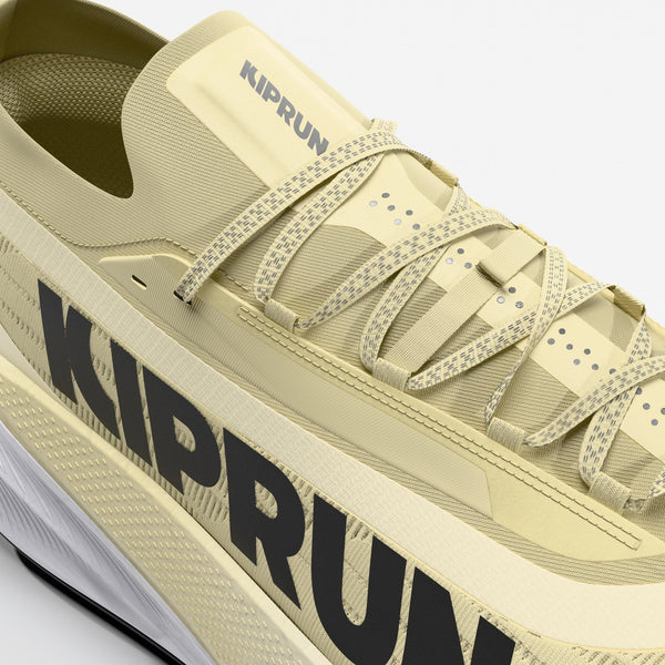 Yellow trail running shoe with 'KIPRUN' branding on a white background
