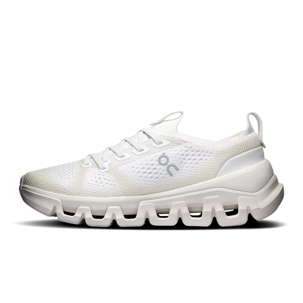 A white athletic sneaker with a textured mesh upper, white laces, and a chunky sculpted sole, shown in a side profile on a white background.
