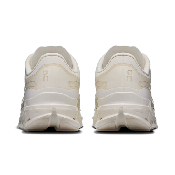 A pair of off-white chunky sneakers shown from the rear, featuring the 'on' logo on the heel and a thick sculpted sole, set against a plain white background.
