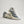 A pair of women's grey and white adidas running adn fashion shoes.