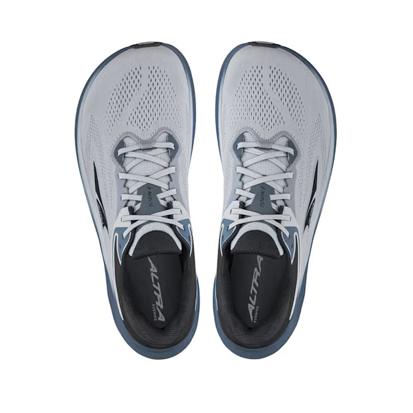 Pair of gray and black running shoes with white laces on a white background