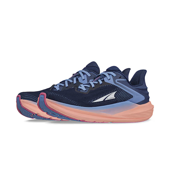Navy and pink athletic shoe on a white background