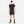 Man wearing a black Nike athletic outfit on a white background