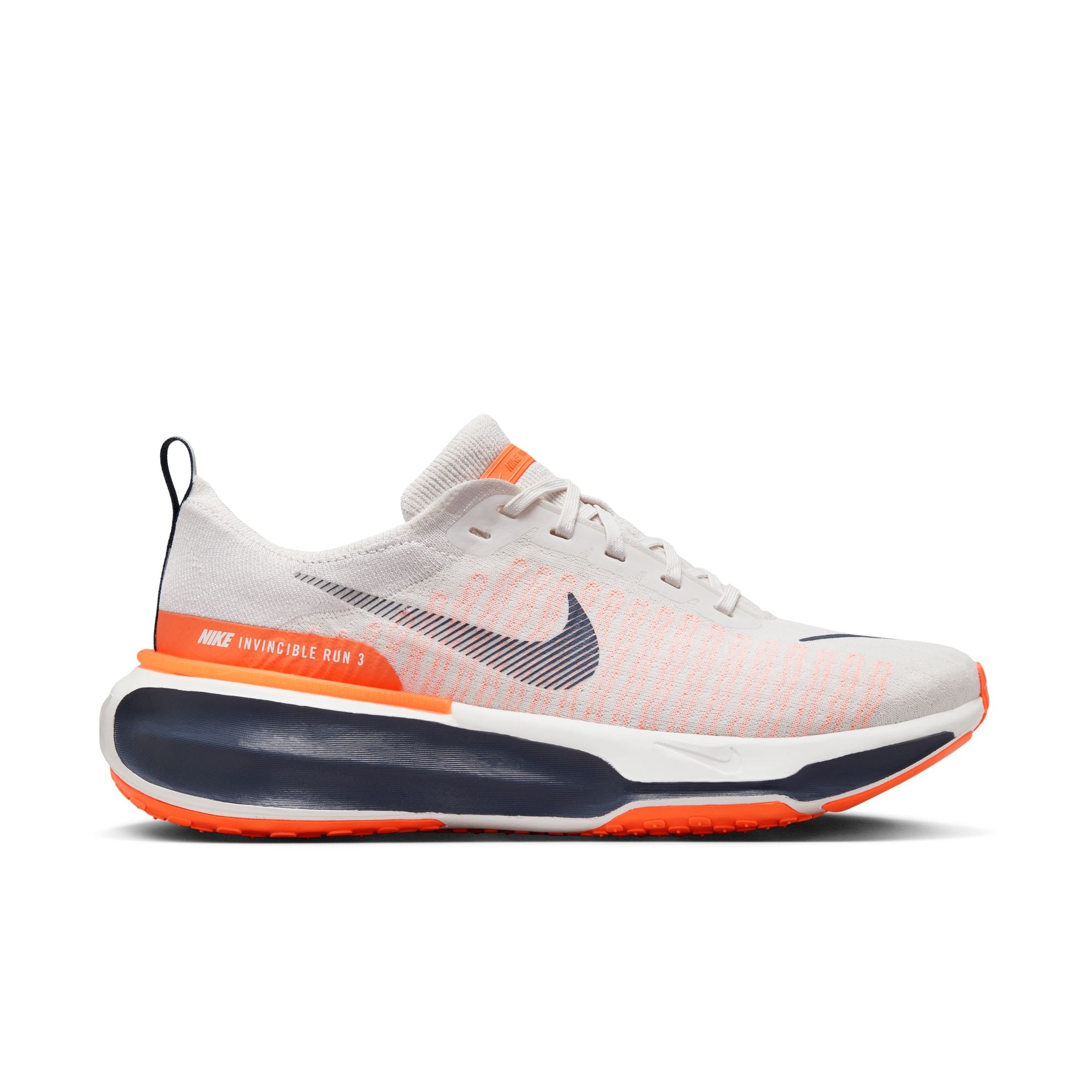 This is a great looking Nike running shoe with a white and orange upper and orange pops of color