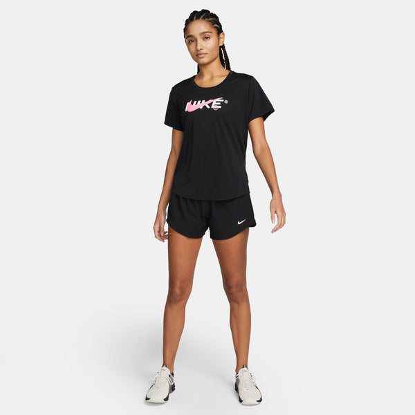 Woman wearing a black Nike t-shirt and shorts on a white background