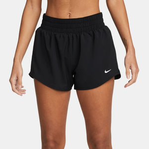 Black Nike shorts worn by a person on a white background