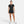 Person wearing a black Nike outfit on a white background