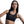 Woman wearing a black Nike sports bra on a white background