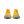 The heel of a pair of bright yellow running shoes with a white sole on a white background.