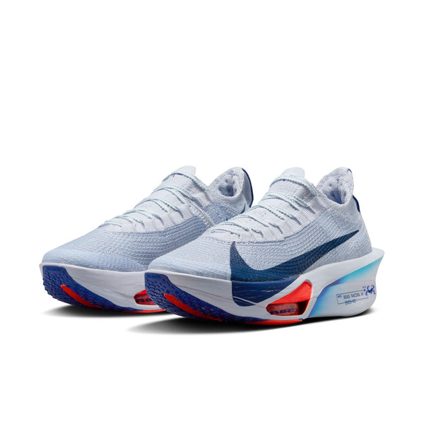 Pair of white running shoes with blue and red accents on a white background.