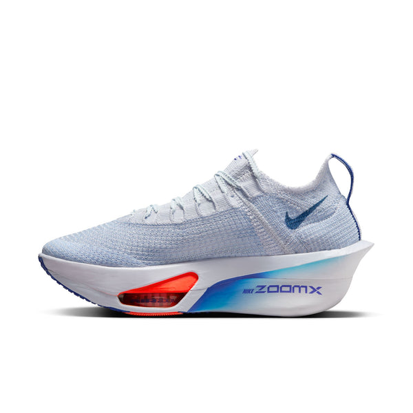 Women's Nike white running shoe with blue and red accents on a white background.
