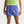 Person wearing blue athletic shorts with a Nike logo on a light gray background