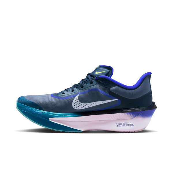 The medial side of a blue and purple running shoe with Nike logo on a white background.