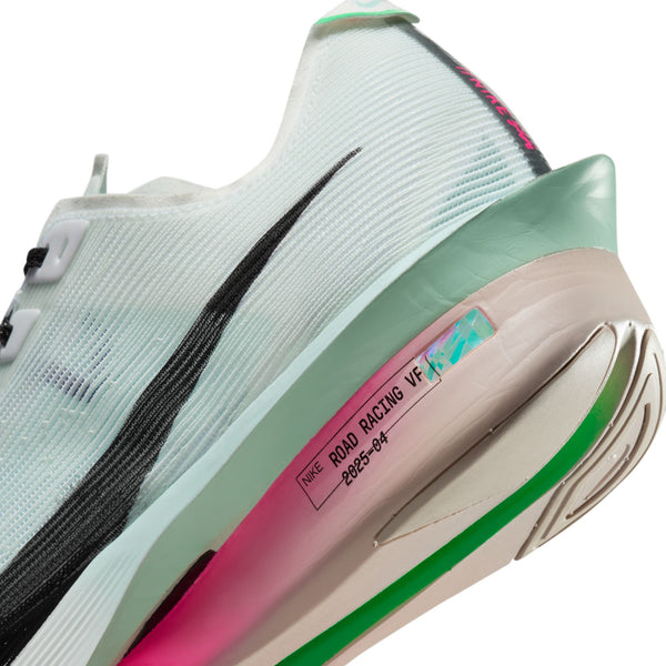 Close-up of a sneaker with a visible brand label on a white background.
