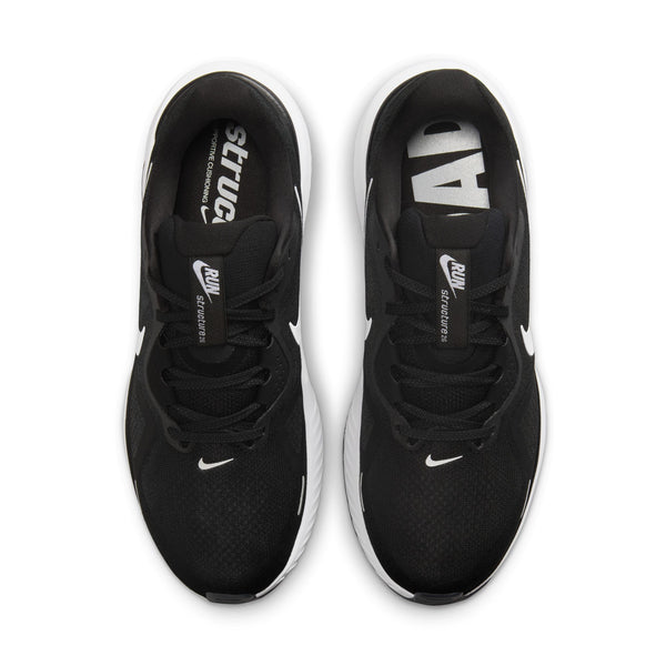 Black running shoes with white accents on a white background.