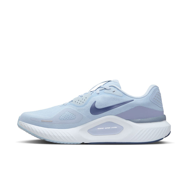 Medial side of a lght blue running shoe with Nike logo on a white background.