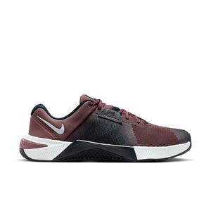 Maroon and black athletic shoe with white sole on a white background