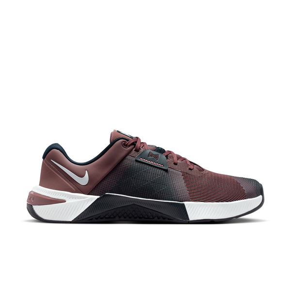 Maroon and black athletic shoe with white sole on a white background