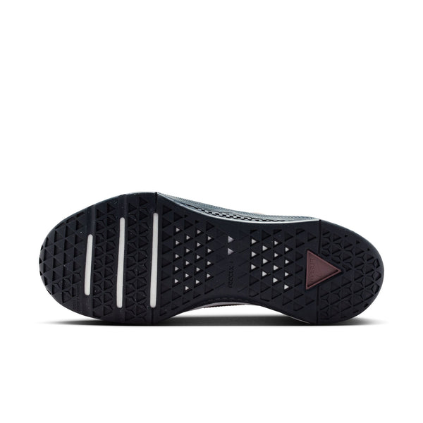 Maroon and black athletic shoe with white sole on a white background