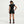 Person wearing a black athletic outfit on a light gray background