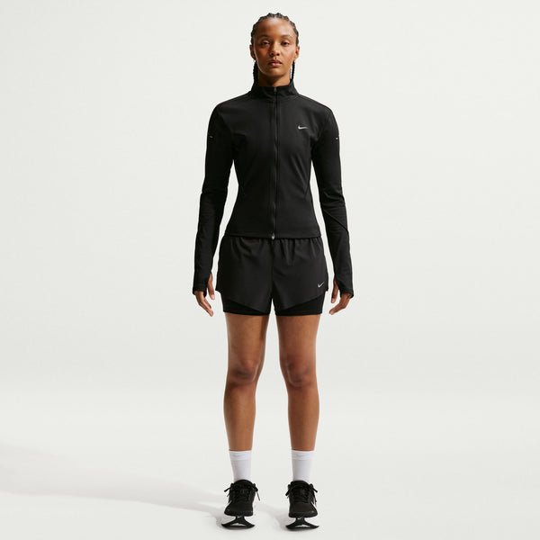 Person wearing a black athletic outfit on a white background