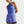 Woman wearing a blue Nike athletic outfit on a white background