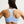Light blue sports bra worn by a person on a plain background