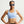 Woman wearing a light blue sports bra with a Nike logo, posing against a plain background.