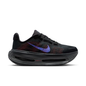 A Nike women's shoe with an almost all black upper adn a sapphire swhoosh.