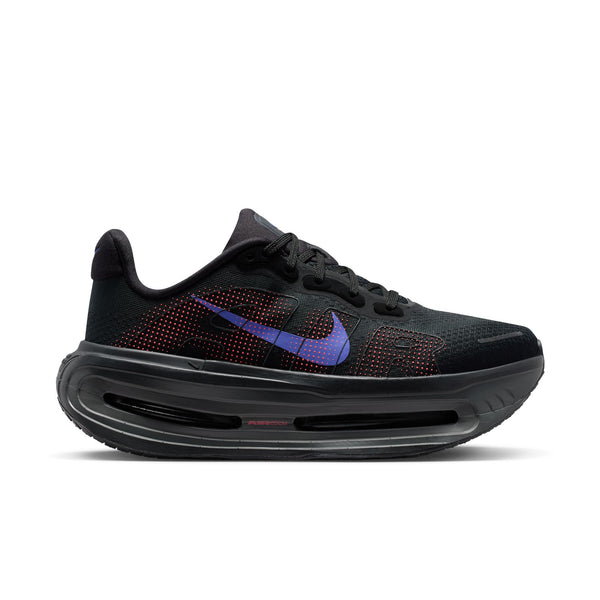 A Nike women's shoe with an almost all black upper adn a sapphire swhoosh.