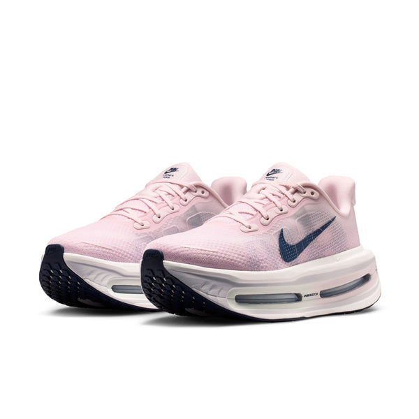 Pink running shoes with a blue Nike logo on a white background