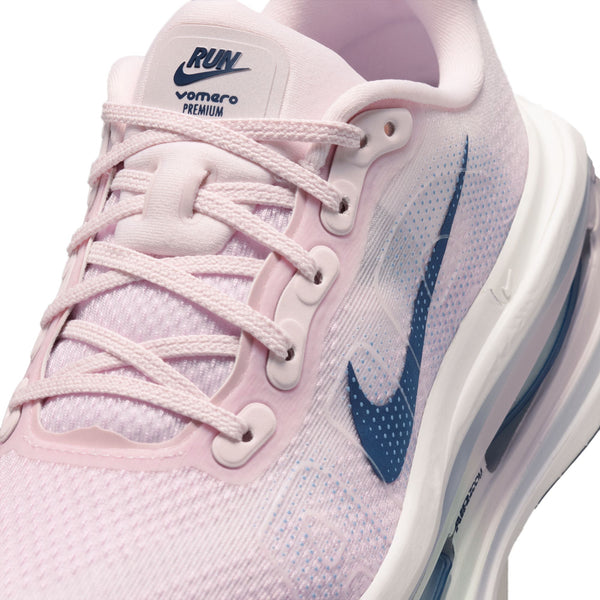 Pink and blue running shoe with visible Nike logo on a white background