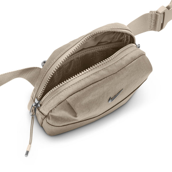 Beige waist bag with a visible brand logo on a white background