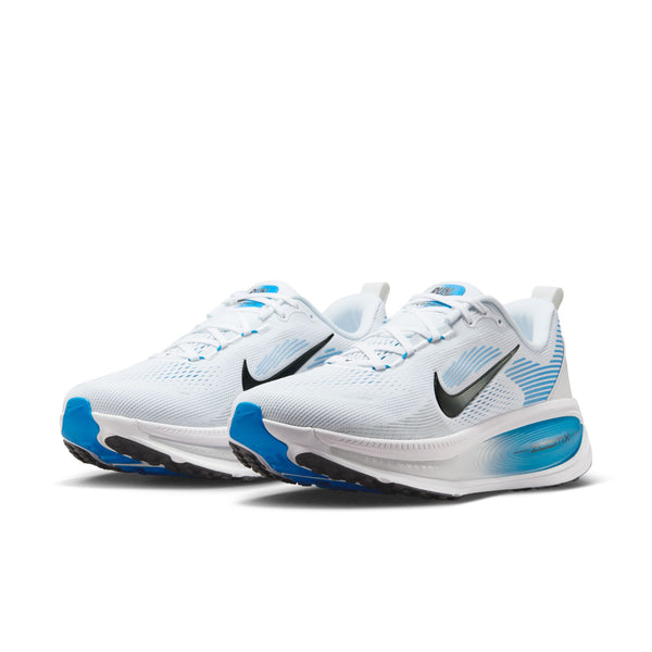 White and blue athletic shoes with Nike logo on a white background