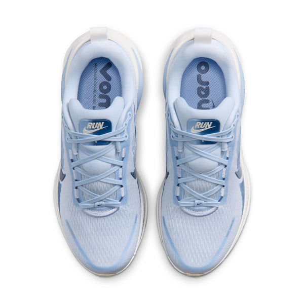 Blue running shoe with white sole on a white background